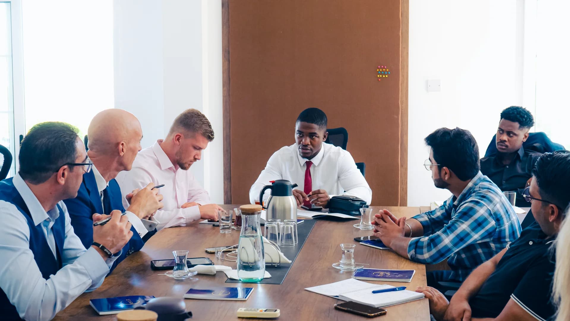 Team meeting in a boardroom discussing strategy